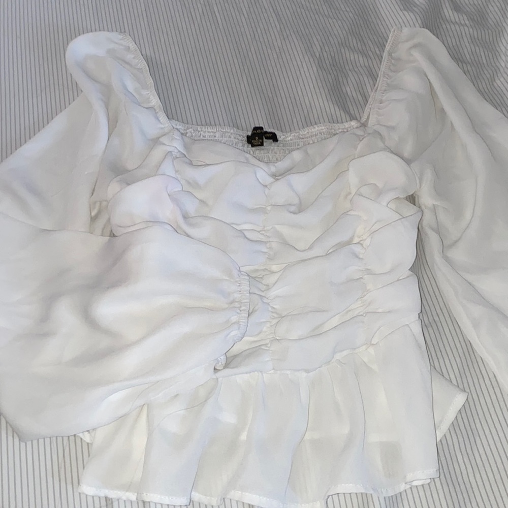 White ruffle blouse